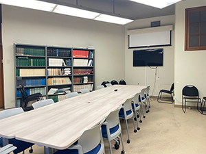 112 Hilgard Conference Room - Reservations - empty room with chairs