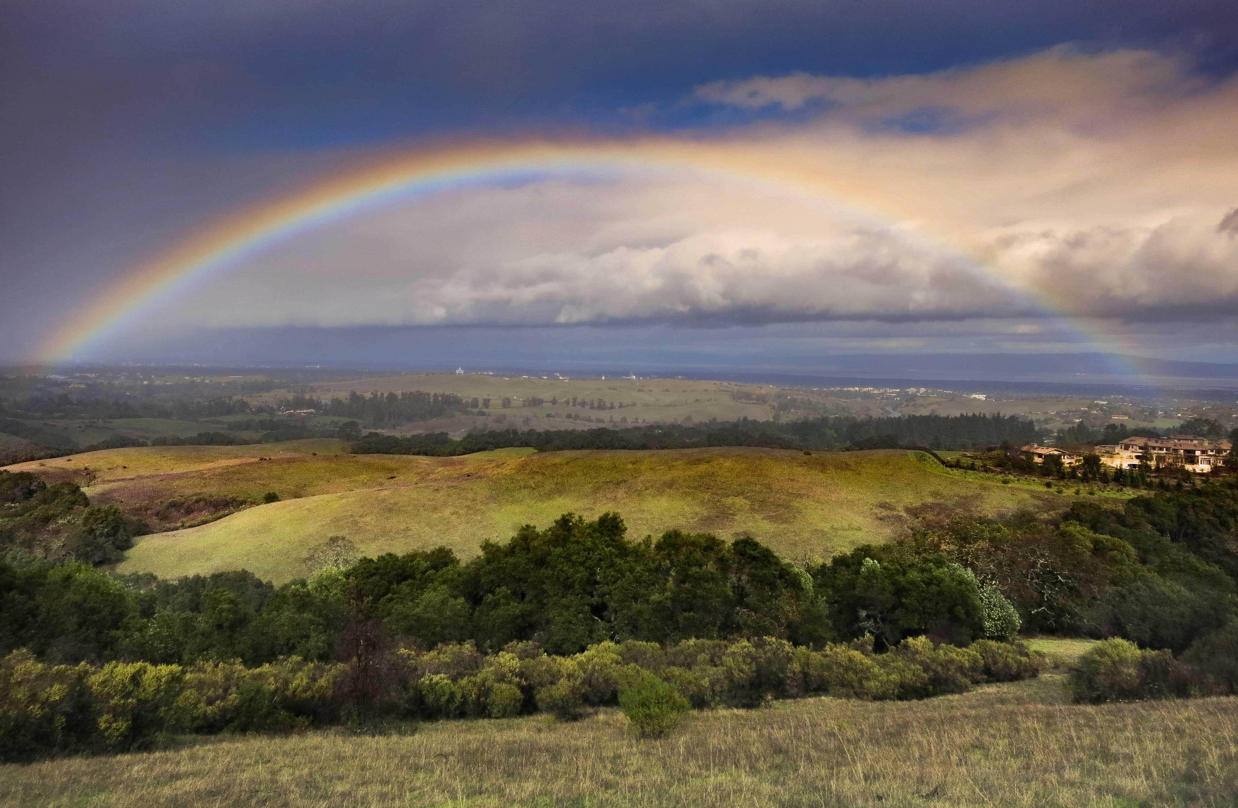 A rainbow over grasslands in California