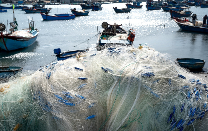 fishing nets on docked seaside boats