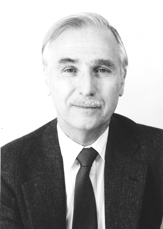 Black and white headshot of Dennis Teeguarden