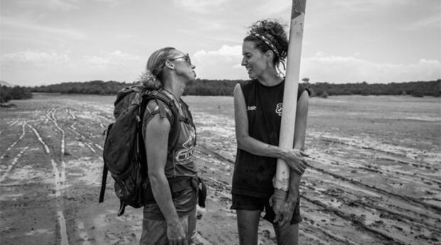 Ariane Arias-Ortiz (right) chats with colleague (left) during fieldwork for Blue Ventures. 