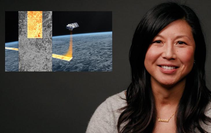 An image of a woman smiling against a dark grey background. A graphic of a satellite in space is in a small box next to her head. 