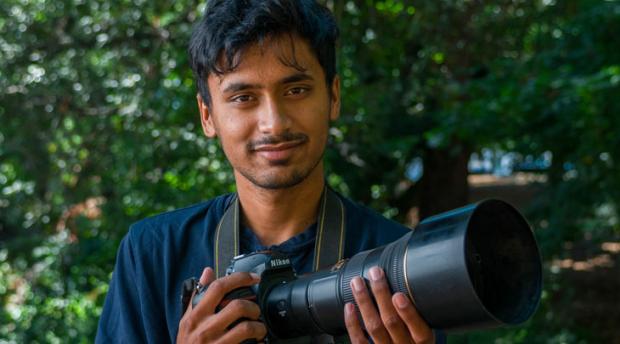 thumbnail image of Vishal holding a camera