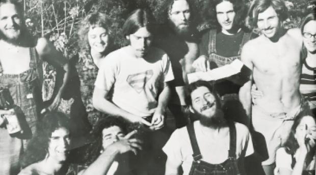 A black and white photo of a group of young people in the 1970s