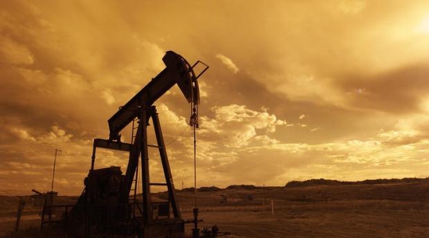 Oil pump jack with sunset