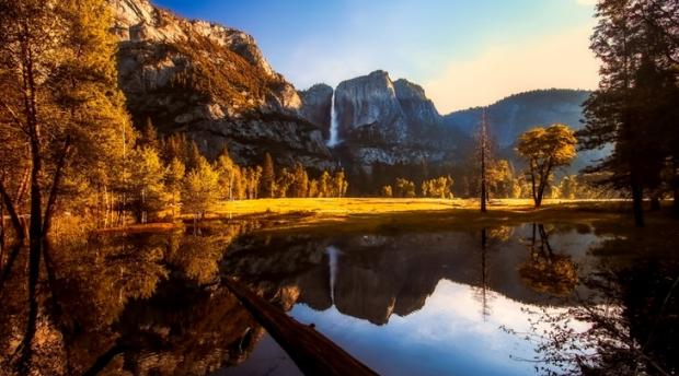 Landscape of Yosemite Valley with waterfall and lake