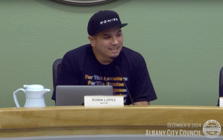 PhD Student Robin Lopez sits at the Council Meeting after being appointed Mayor of Albany